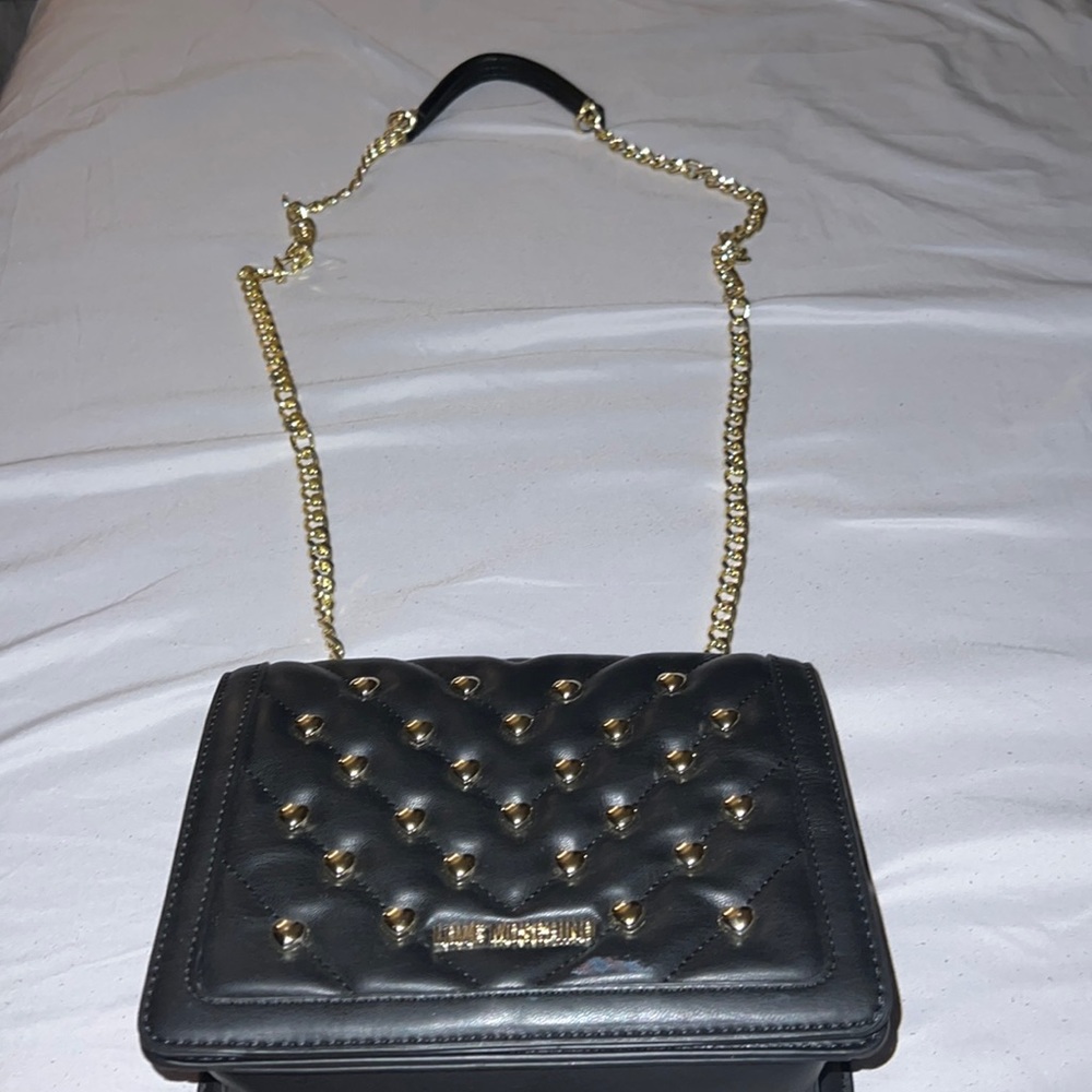 Black Love Moschino with gold shoulder chain
